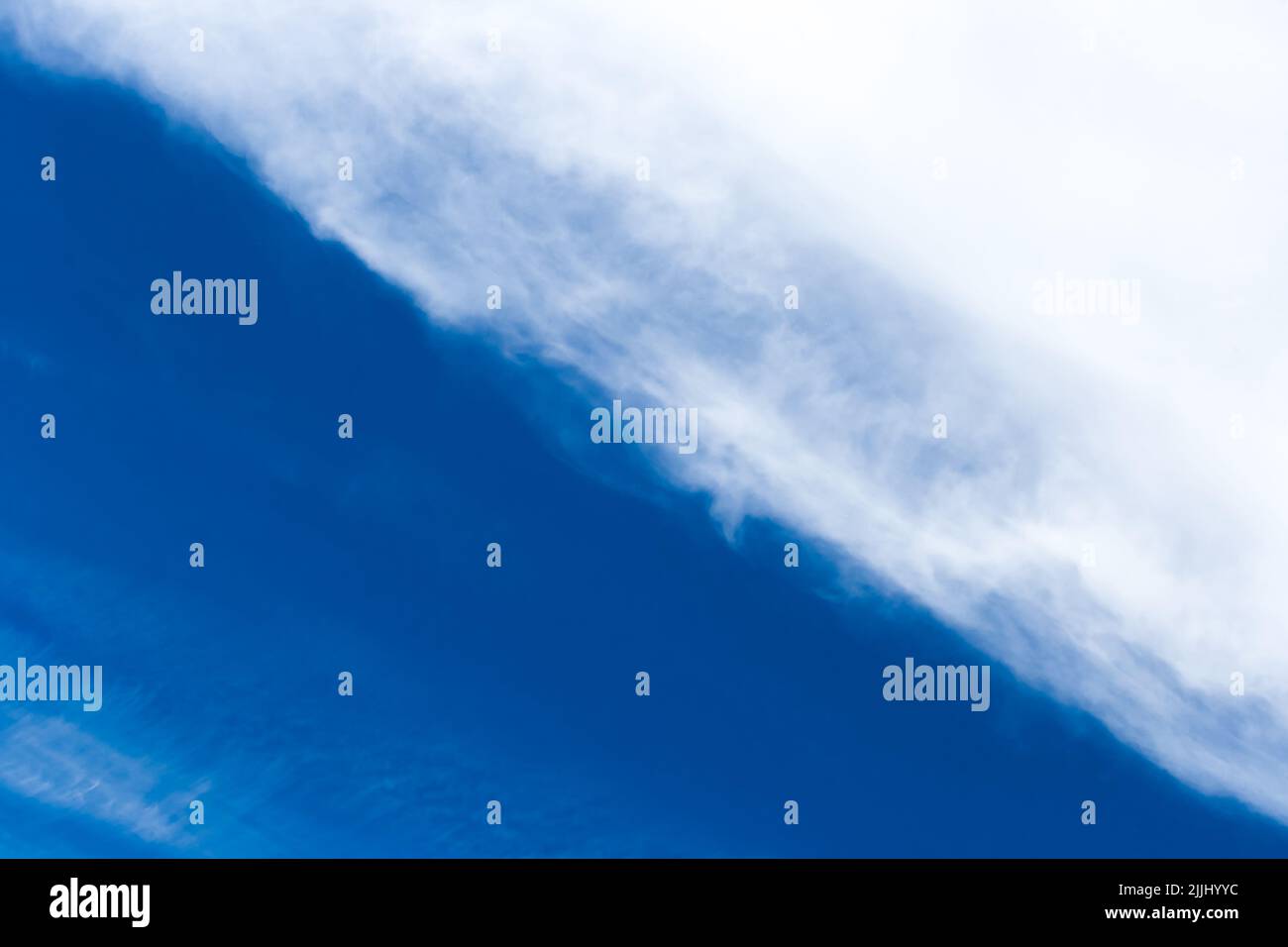 Diagonal line pattern abstract nature of white clouds and blue sky background. Stock Photo