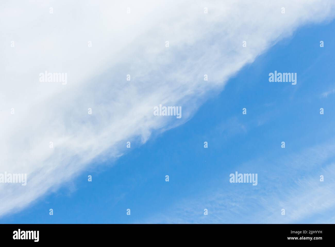 Diagonal line pattern abstract nature of white clouds and blue sky background. Stock Photo