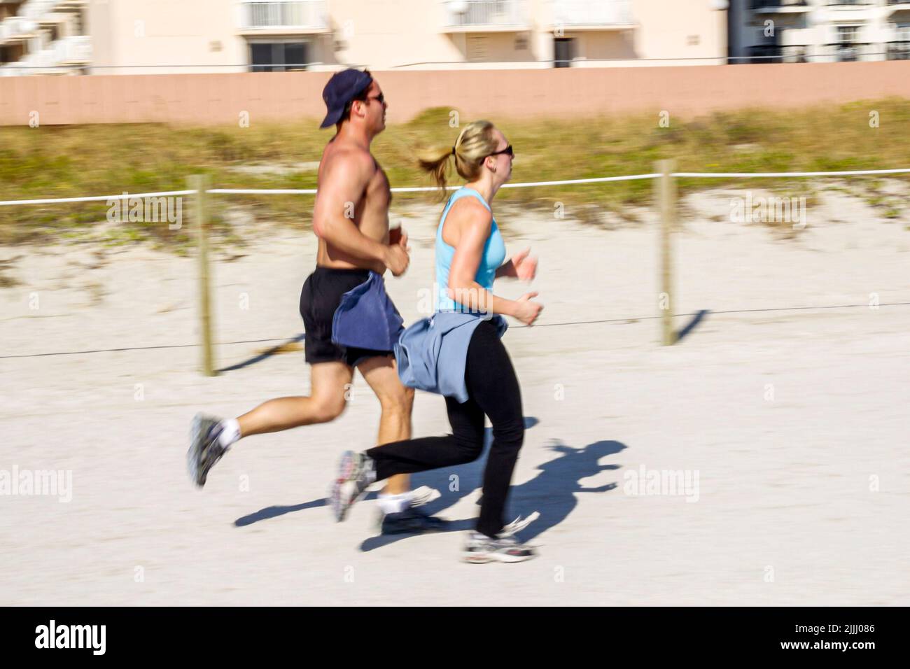Miami Beach Florida,jogger,joggers,jogging,runner,runners,running,public beaches,sand Stock Photo