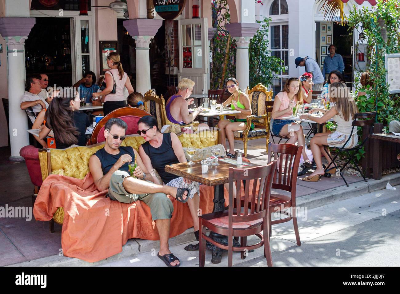 Miami Beach Florida,Espanola Way,tourist attraction,street,sidewalk cafes,Spanish influenced architecture,al fresco sidewalk outside outdoors tables,d Stock Photo