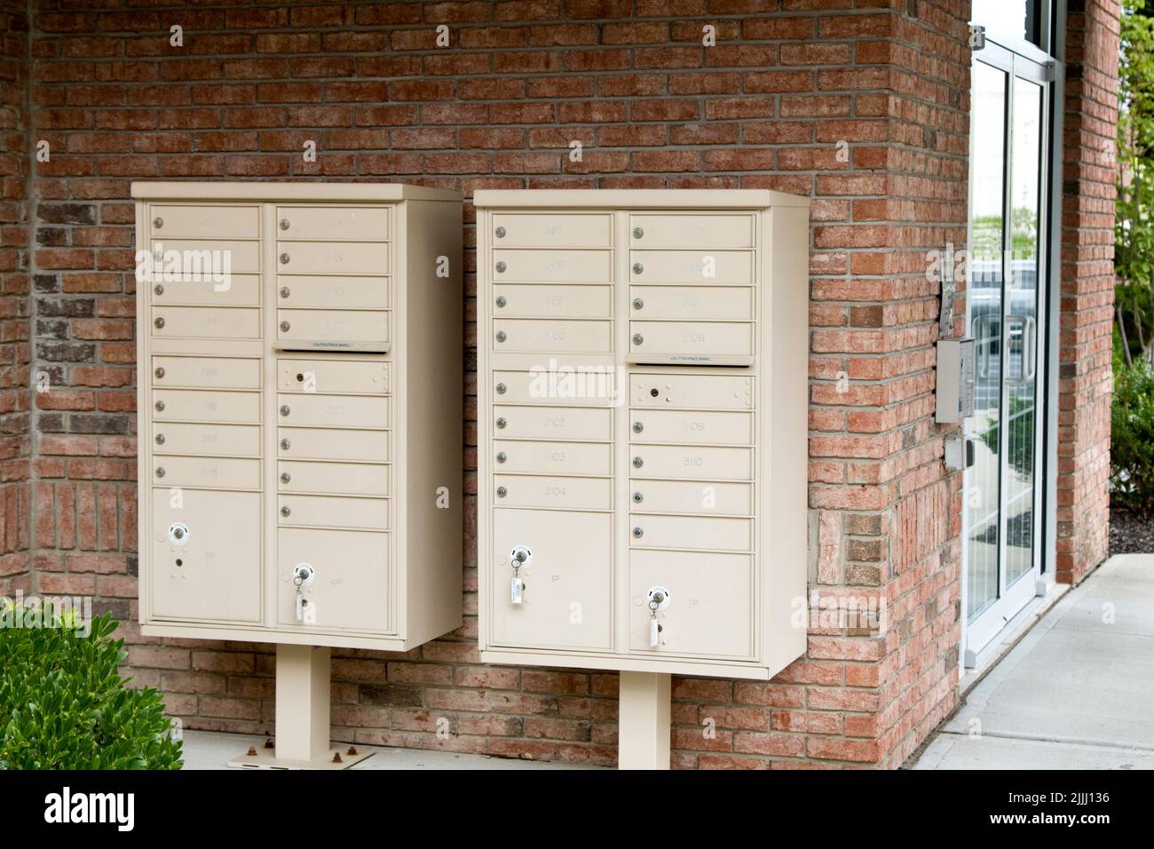 Apartment mail boxes at entrance of high rise building. Stock Photo