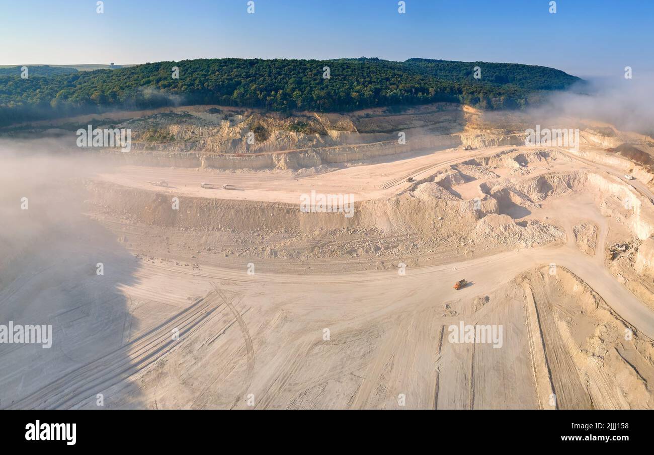 Aerial view of open pit mining site of limestone materials extraction