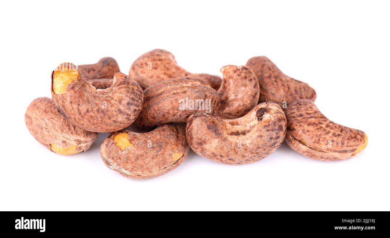 Cashew nuts in shell isolated on white background. Roasted and salted