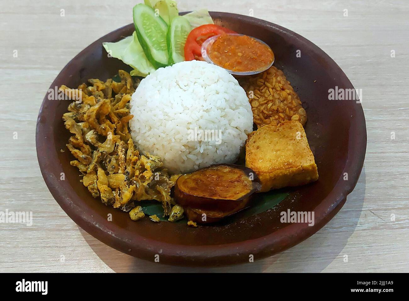 Rice and Fried Baby Fish Penyet at Cafe Jakarta Indonesia Stock Photo