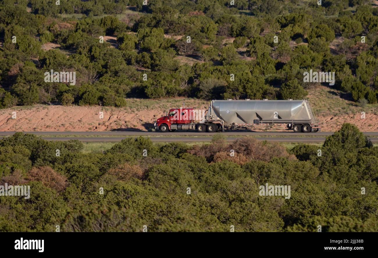 A bulk food grade truck on a rural New Mexico highway delivers its