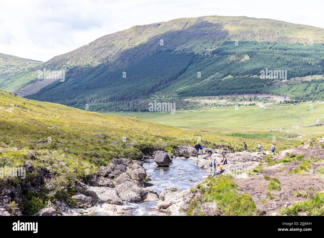 Fairy pools on the Isle of Skye near Glenbrittle, walkers and visitors explore the pools on a summers day,Isle of Skye,Scotland,UK Stock Photo