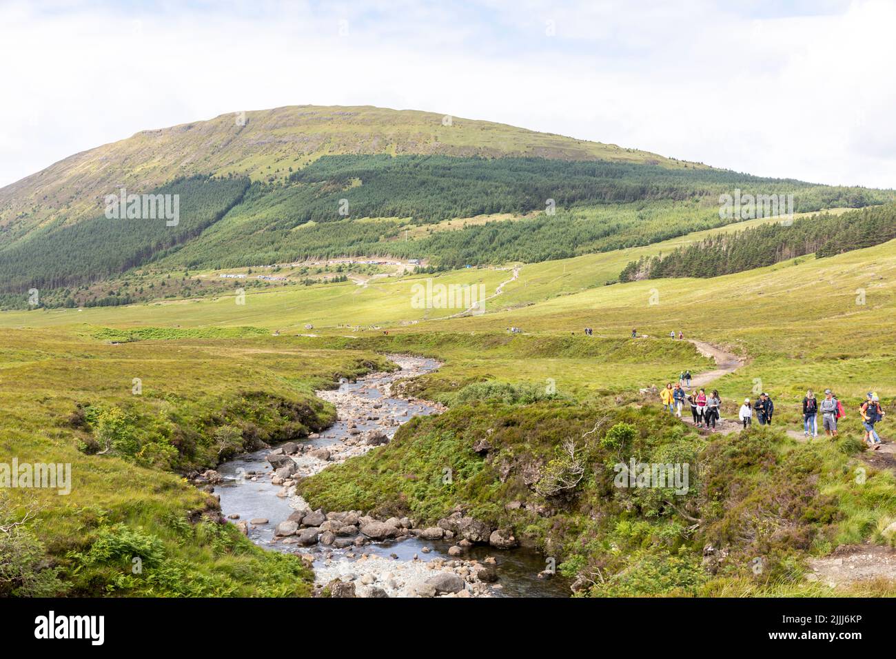 Fairy pools on the Isle of Skye near Glenbrittle, walkers and visitors explore the pools on a