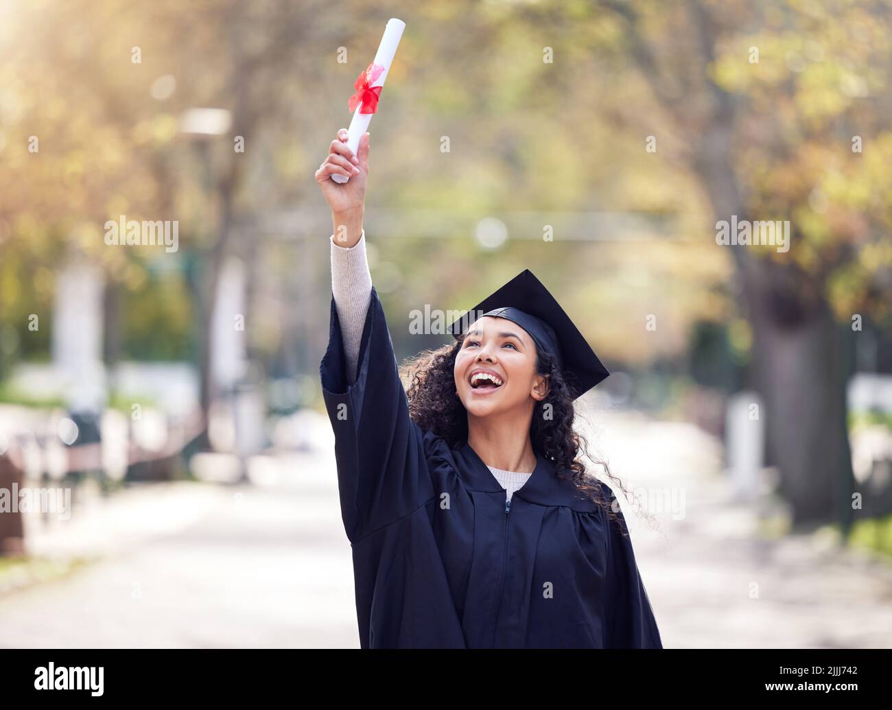 Congratulations on my graduation. a young woman cheering on graduation day. Stock Photo