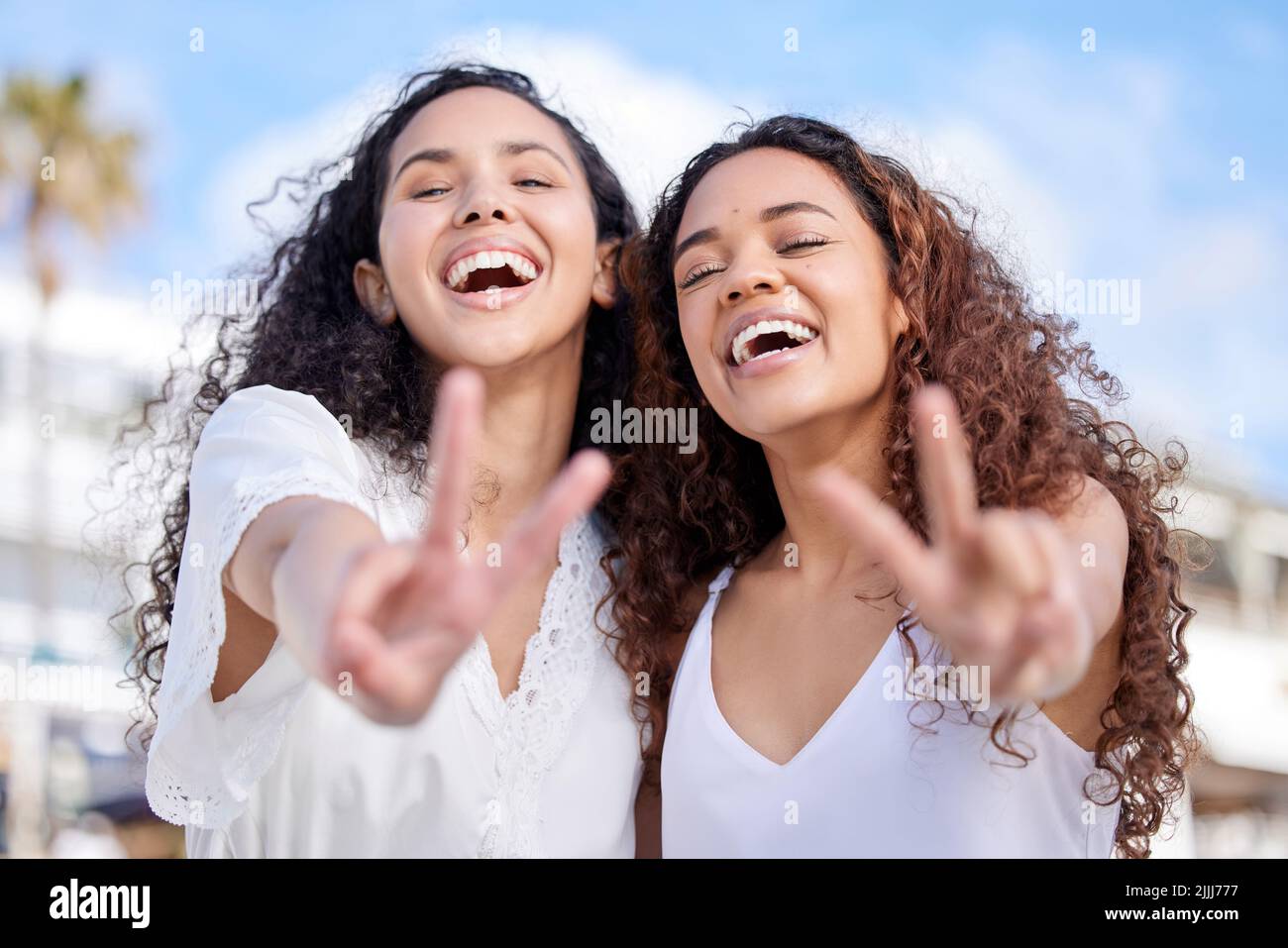 Heres to more good times together. two young women making peace ...