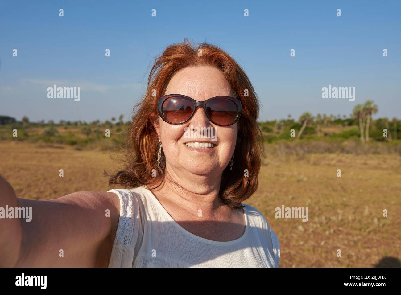 Self portrait of an hispanic mature woman wearing sunglasses in El