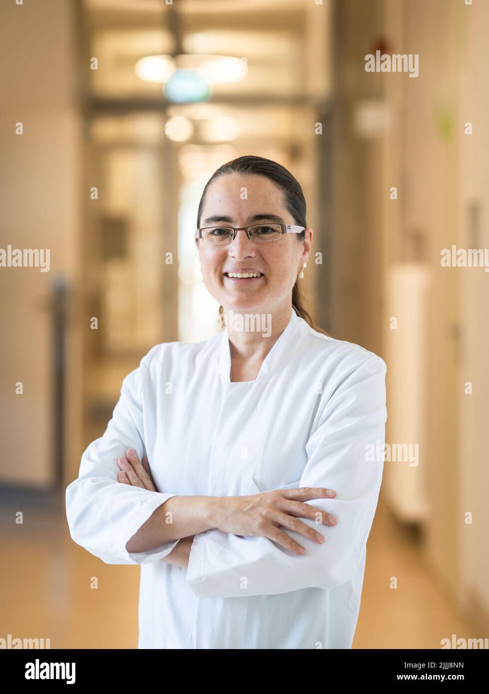 22 July 2022, Hessen, Frankfurt/Main: Maria Vehreschild, head of infectious diseases at Frankfurt University Hospital, is standing in the hallway of one of the buildings. Together with a colleague, she is also head of the Long Covid Outpatient Clinic. (to dpa: "Long waiting lists for patients with Covid late effects in Hesse") Photo: Frank Rumpenhorst/dpa Stock Photo