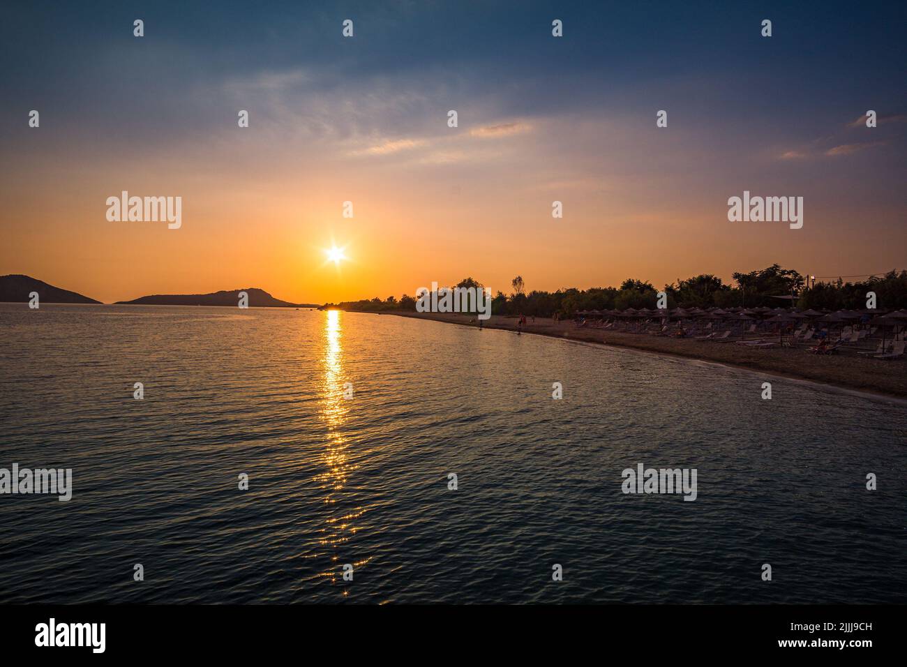 The amazing sandy beach of Gialova seaside town at sunset in Messenia, Peloponnese, Greece, Europe. Stock Photo