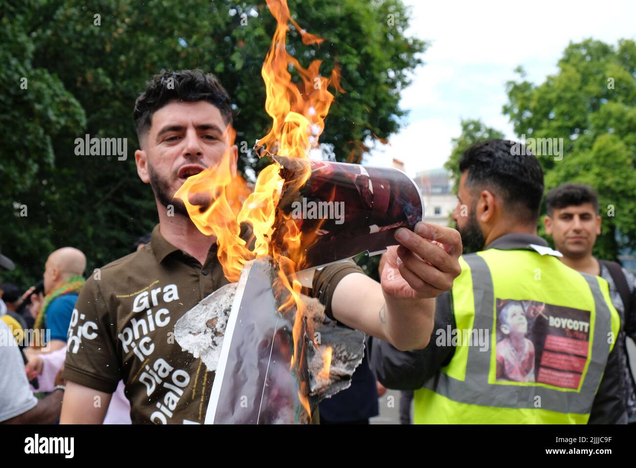 London, UK, 26th July, 2022. Members of the Kurdish community protest opposite the Turkish Embassy following artillery fire which killed nine civilians, including a baby, in a tourist area near the city of Zakho. Turkey denies involvement, blaming the Kurdistan Workers' Party (PKK) for the incident, though it is believe the group do no have any artillery based there. Credit: Eleventh Hour Photography/Alamy Live News Stock Photo