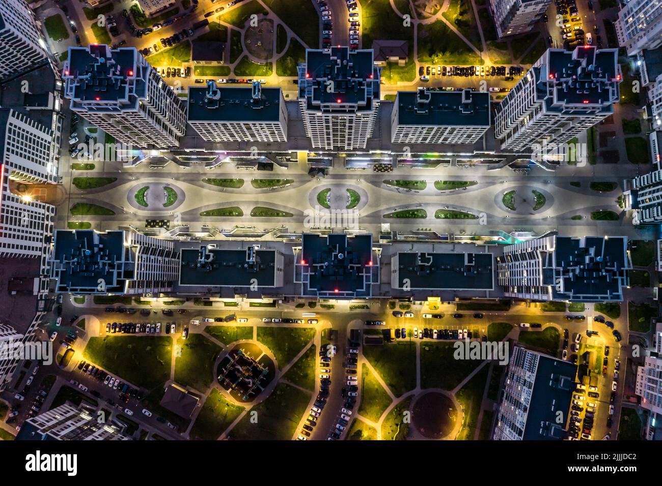 courtyard of high-rise residential buildings complex at night. modern urban architecture. aerial top view. Stock Photo