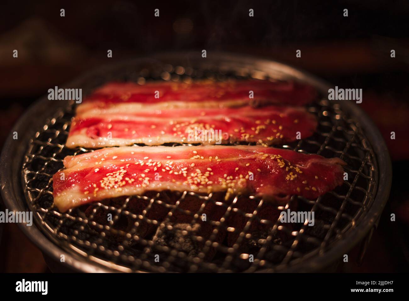 Grilling wagyu beef on charcoal grill ,Japanese barbecue roaster Stock