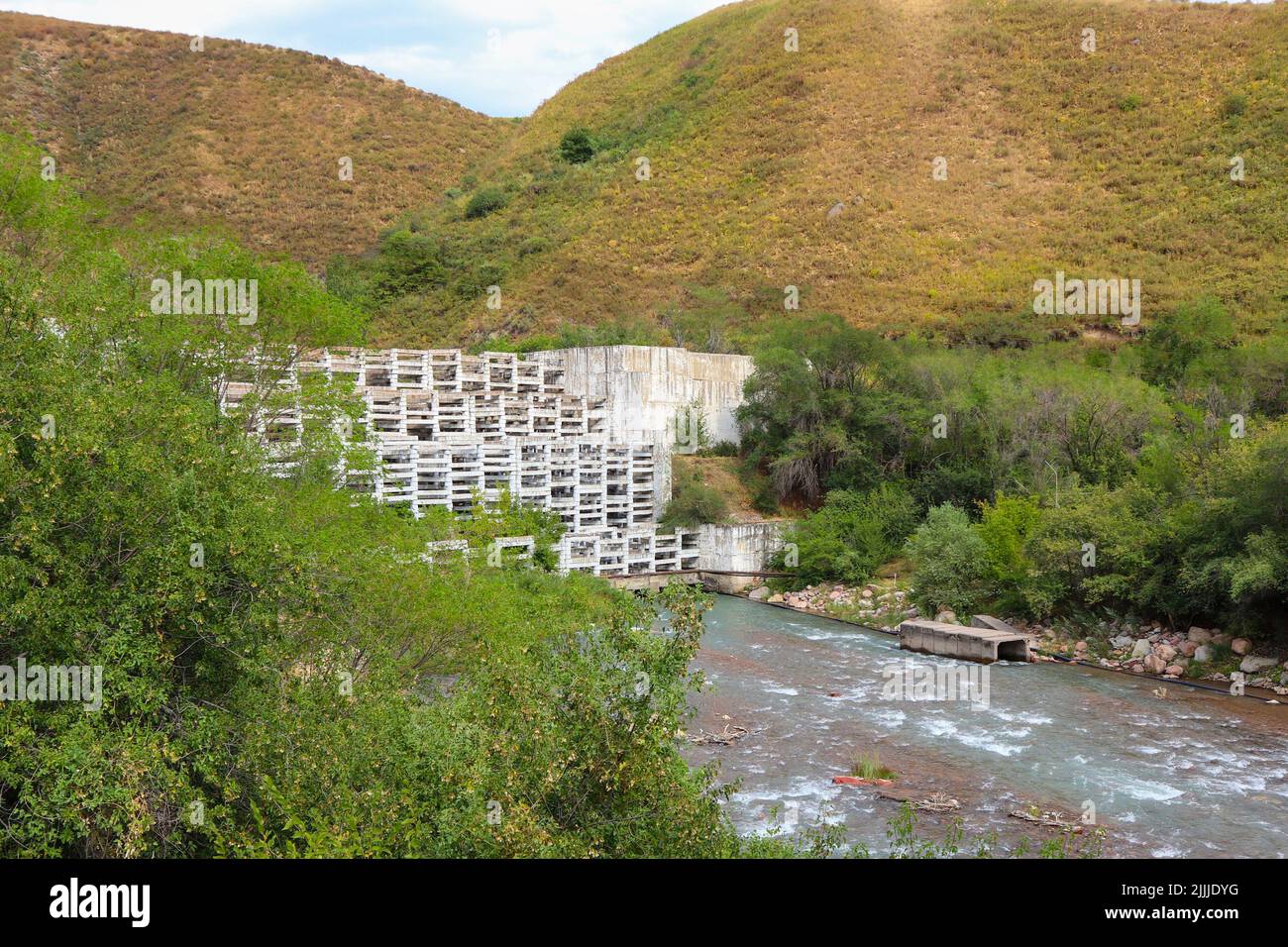 protection from mudflow of the upland river. barrage on the river Stock Photo
