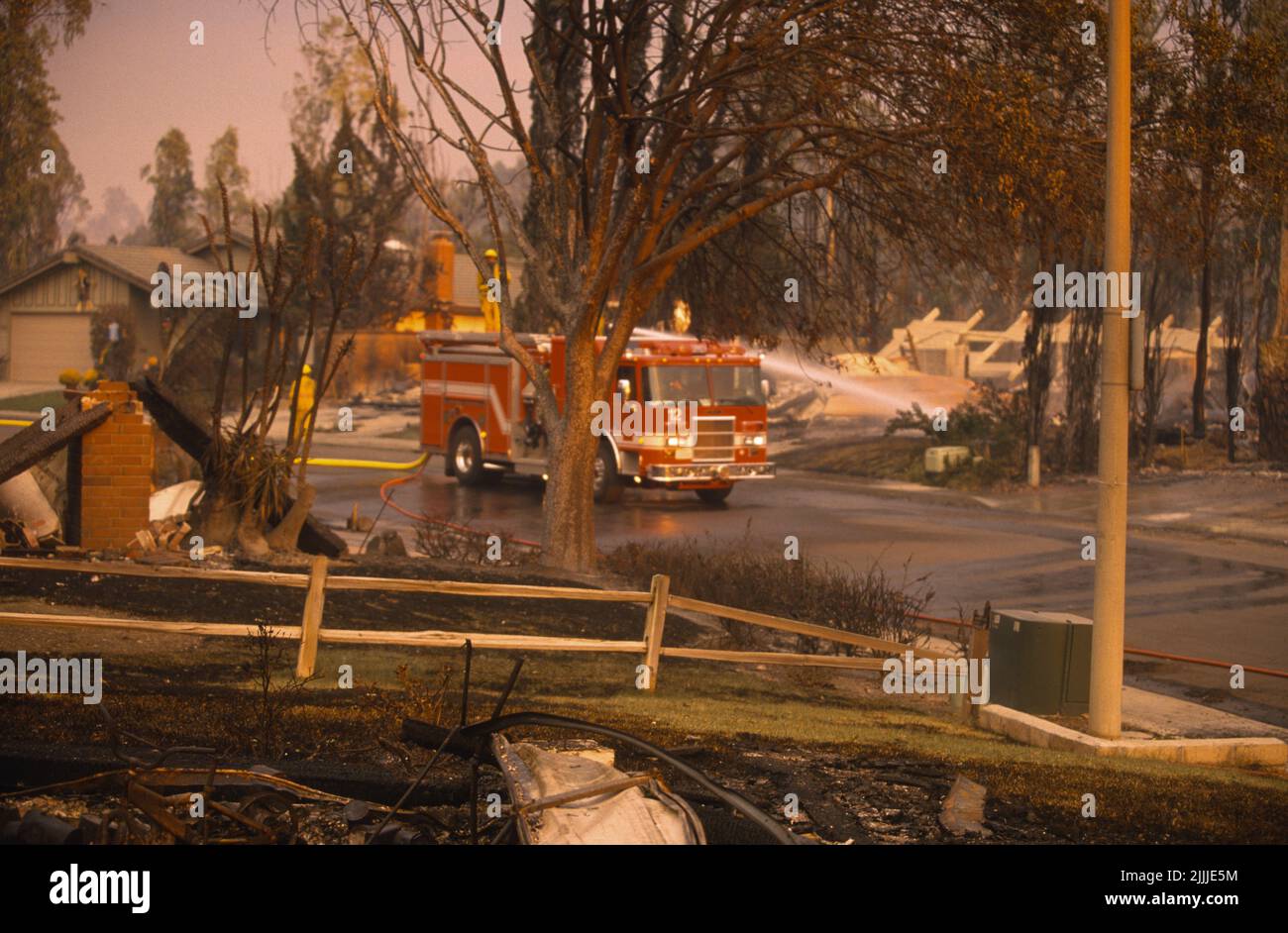 San Diego FireRescue Engine 12's crew douses hot spots at the Cedar