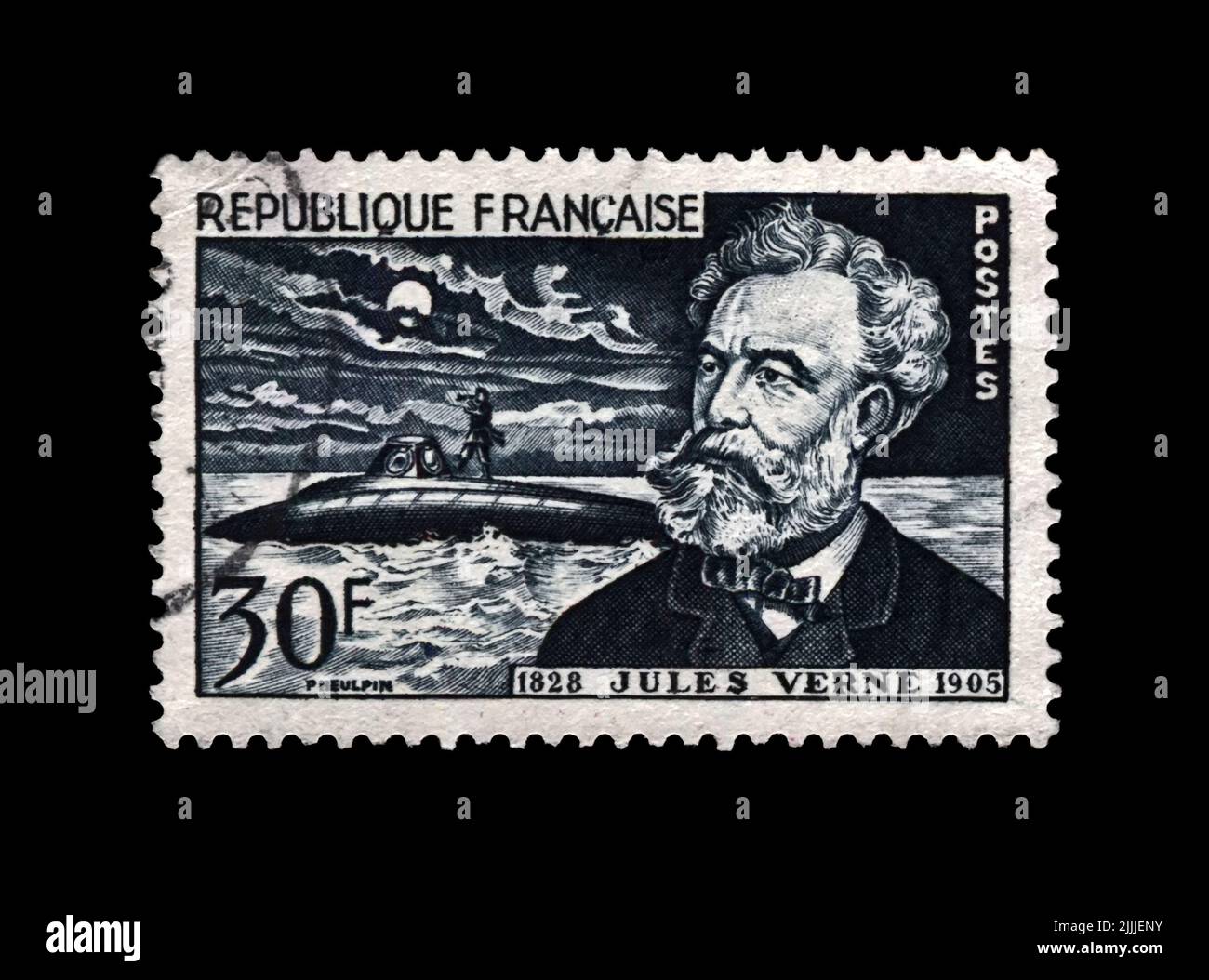 canceled postal stamp printed in France shows Jules Verne (1828-1905), famous science writer and Nautilus submarine, circa 1955. Stock Photo