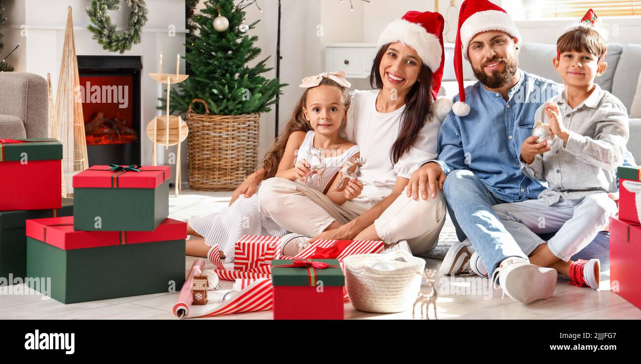 Happy family celebrating Christmas at home Stock Photo Alamy