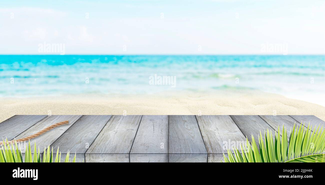 Summer holiday background with wooden deck or flooring, sea, blue sky and white sand Stock Photo