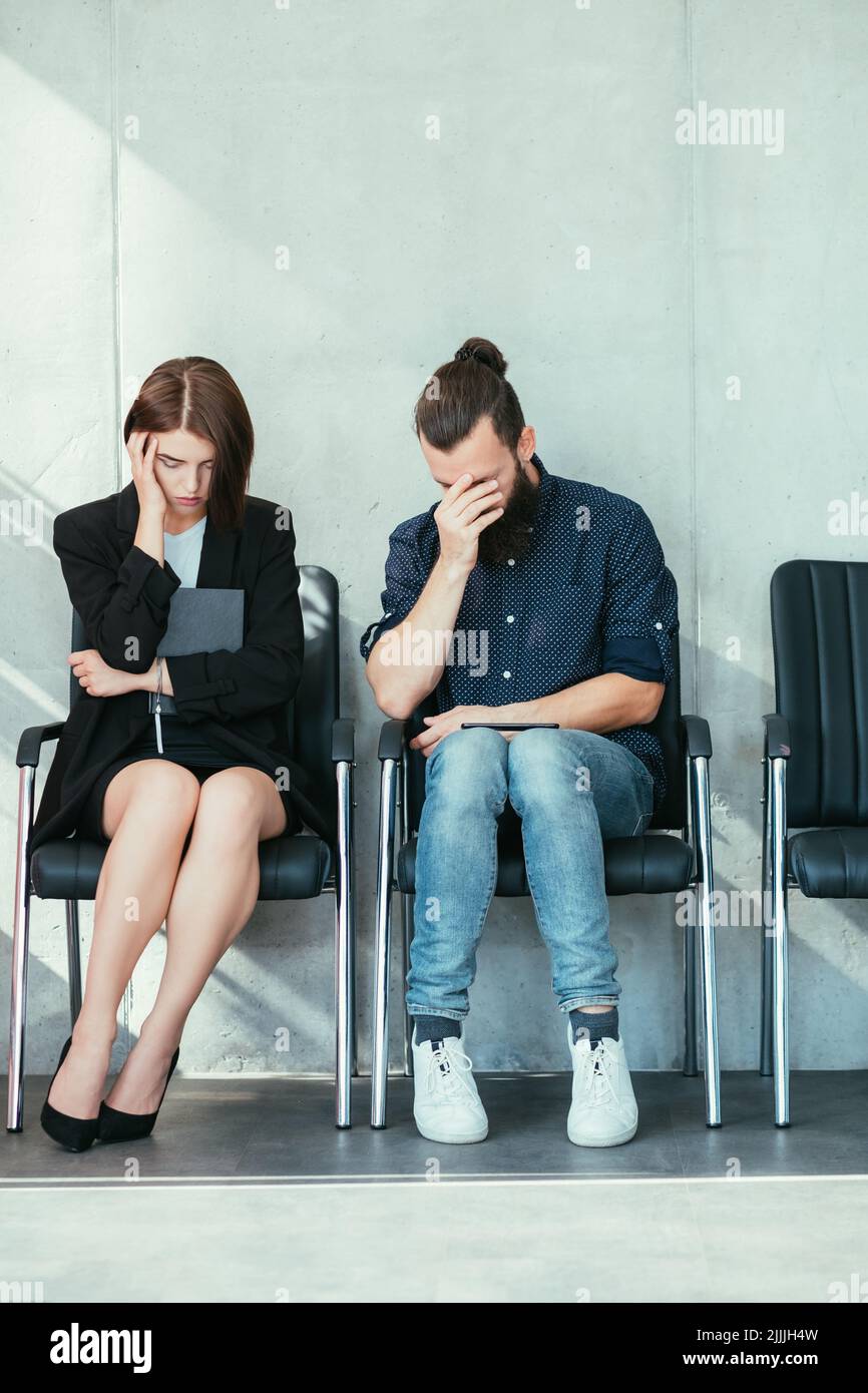 job interview failure unemployed young man woman Stock Photo