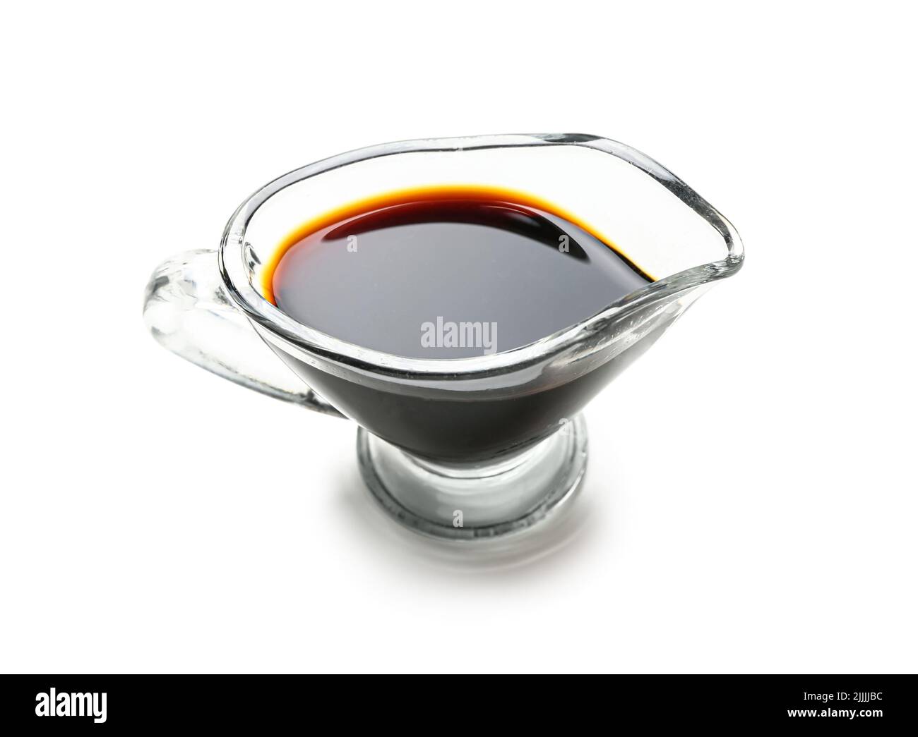 Gravy boat of soy sauce on white background Stock Photo Alamy