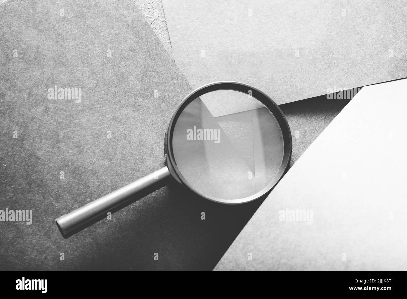 magnifier search seek look recruit grey paper Stock Photo