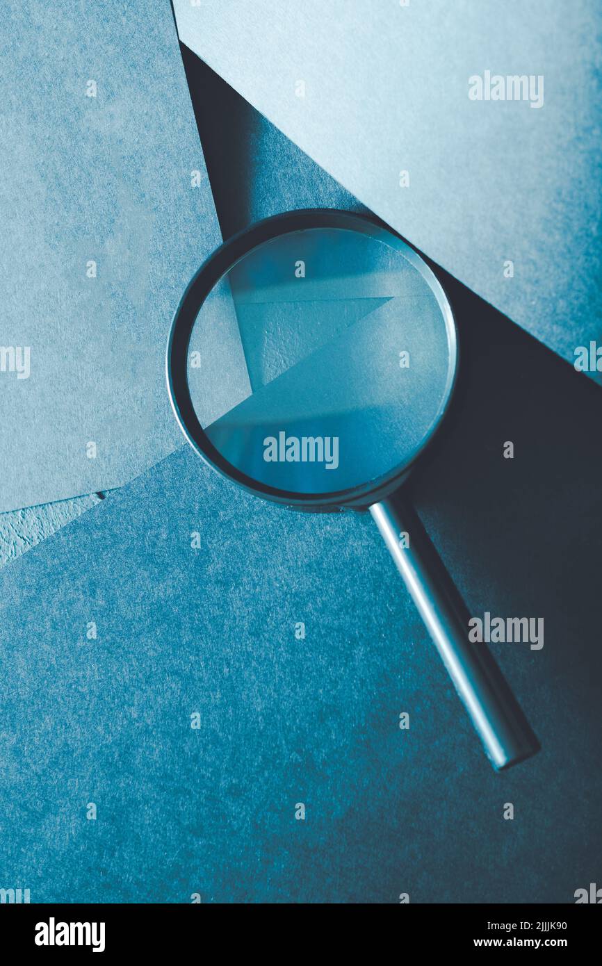 magnifying glass science research explore scrutiny Stock Photo