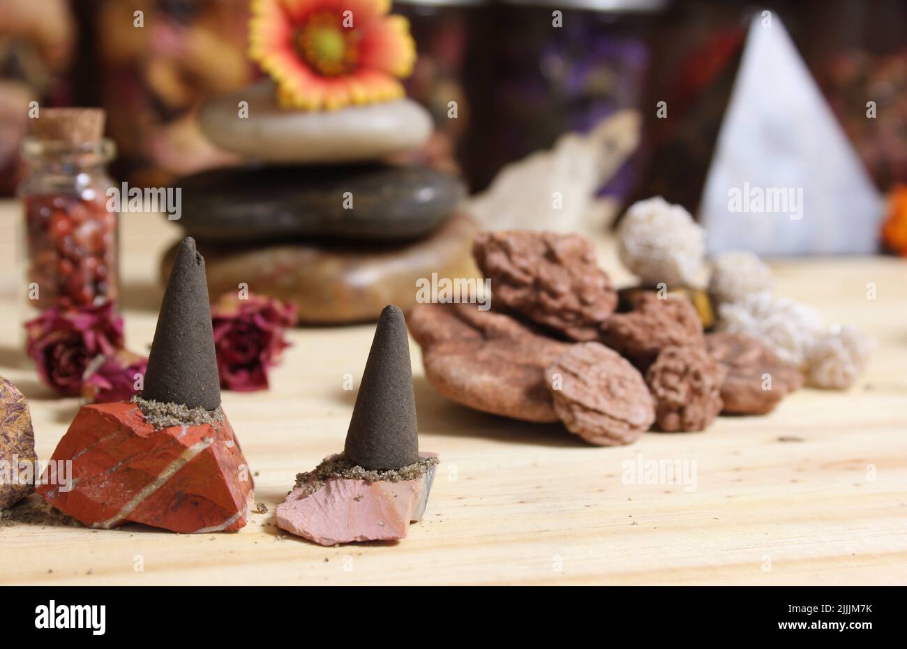 Incense Cones and Desert Rose Rocks on Meditation Table With Pyramid in ...