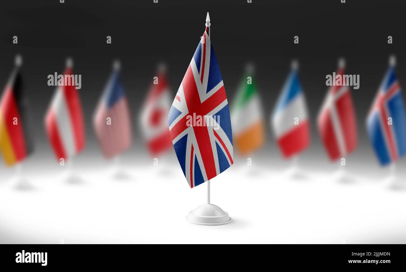 The national flag of the United Kingdom on the background of flags of