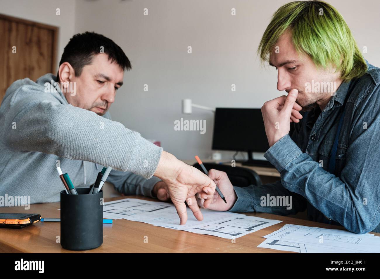 Team of two colleagues interior designers working on architectural ...