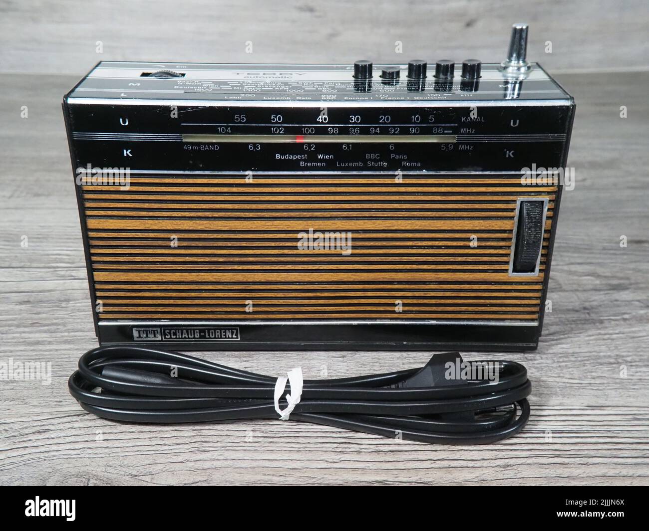 ITT Schaub-Lorenz Teddy Portable Radio on drift wood surface with power  cable Stock Photo - Alamy
