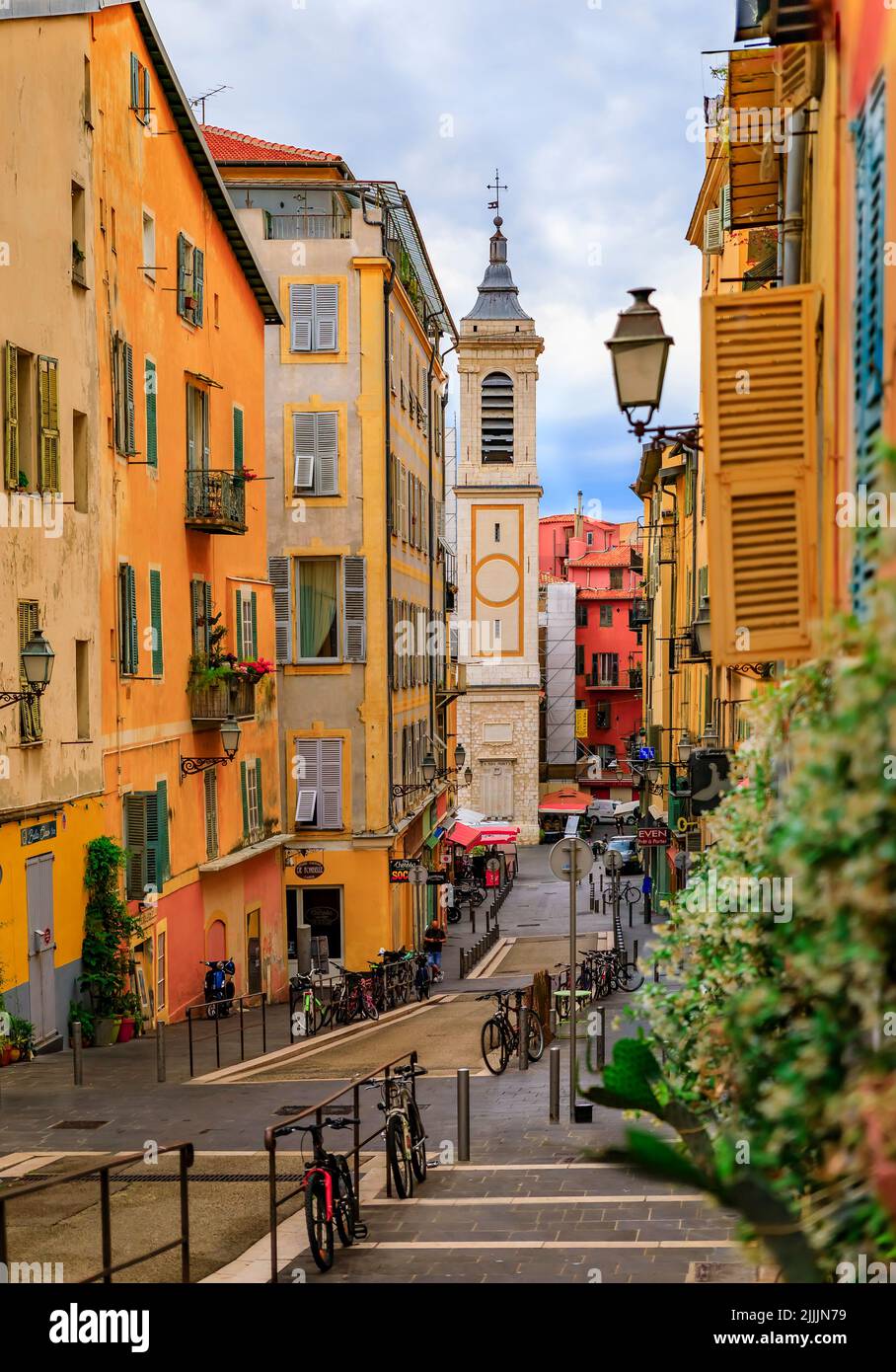 Nice, France - May 25, 2022: View onto Place Rossetti and Sainte Reparate Cathedral Basilique, blurred jasmine blossom in foreground, French Riviera Stock Photo