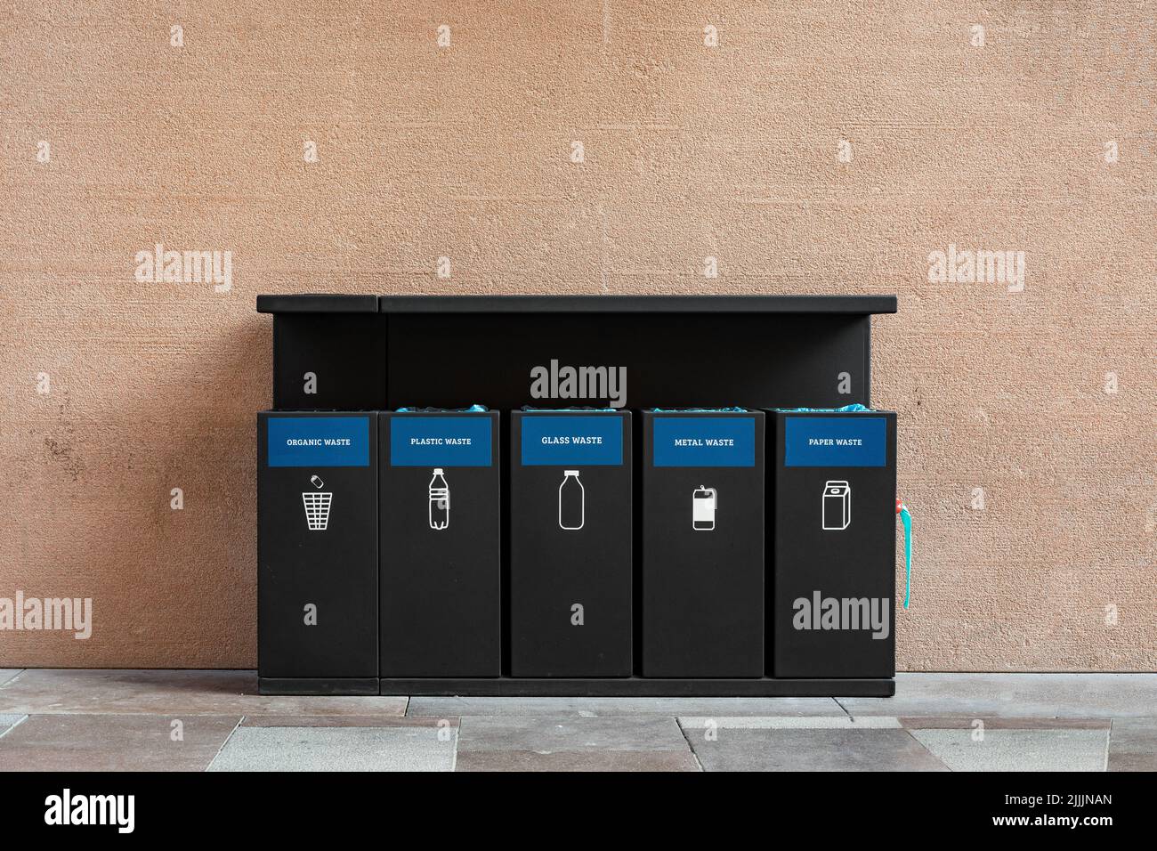 Black wastebaskets for separation of garbage on the street of Istanbul