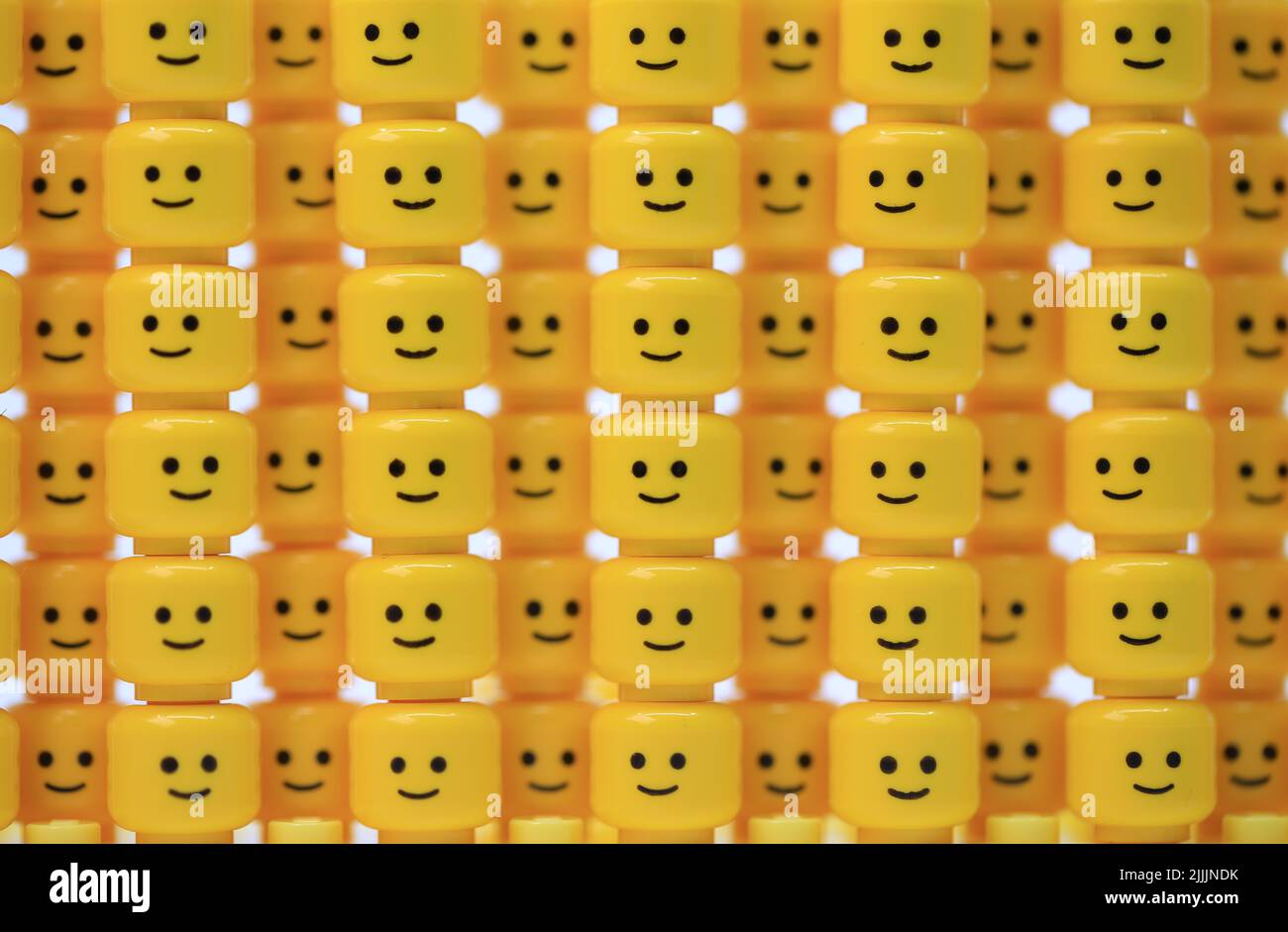 thousand of happy face head have been built as the wall Stock Photo