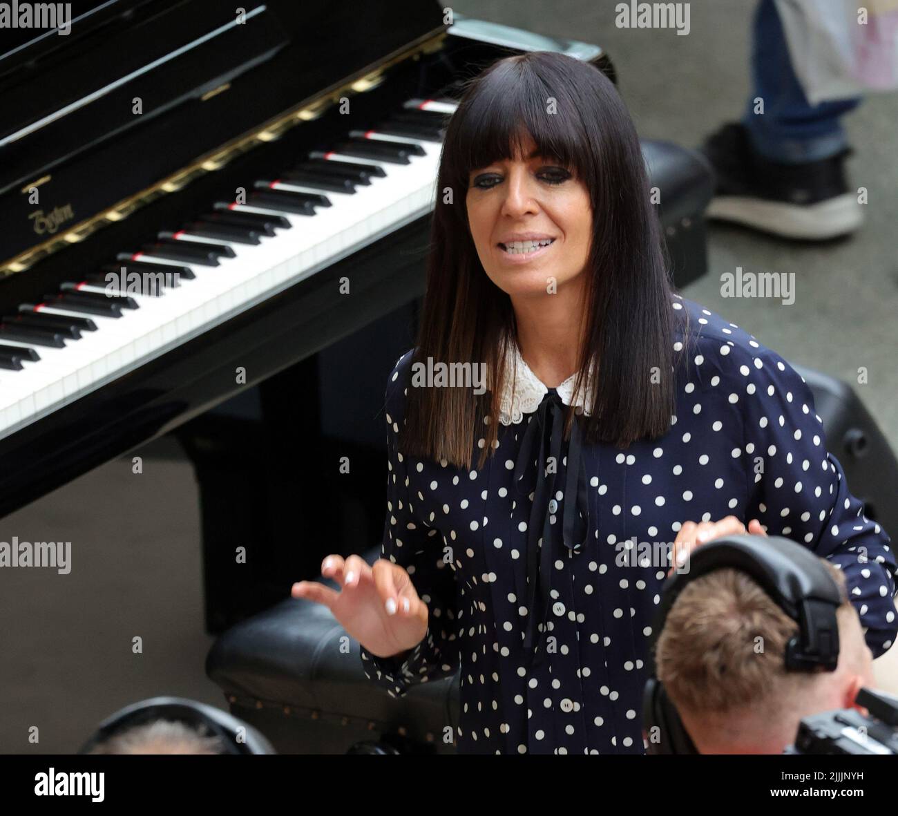 pic shows:  Claudia Winkleman and queues Strictly Star Claudia Winkleman, 50,  as she filmed a segment for a new TV series on piano playing.  As huge Stock Photo
