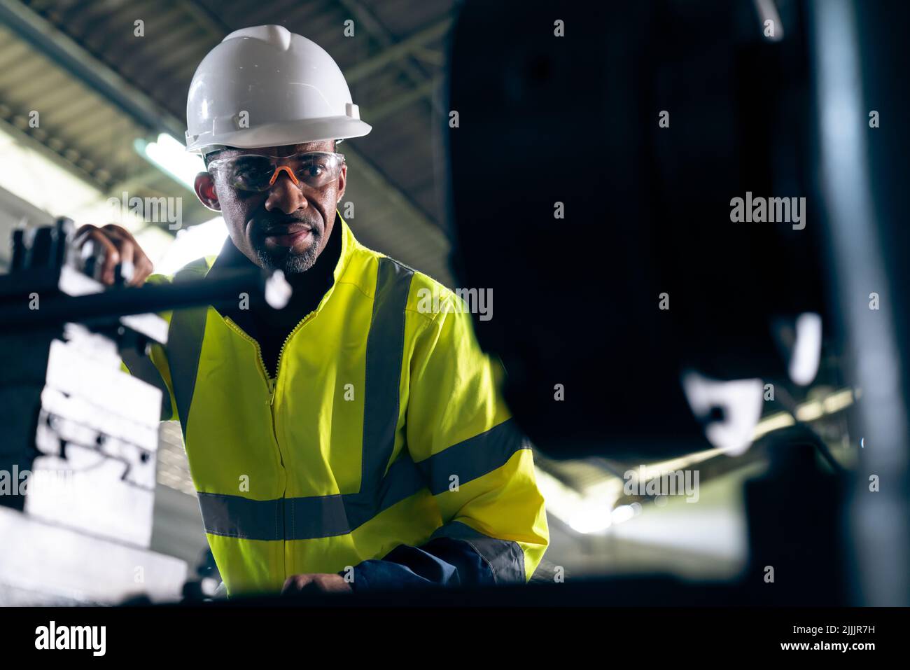 Factory worker or engineer do machine job in adept manufacturing