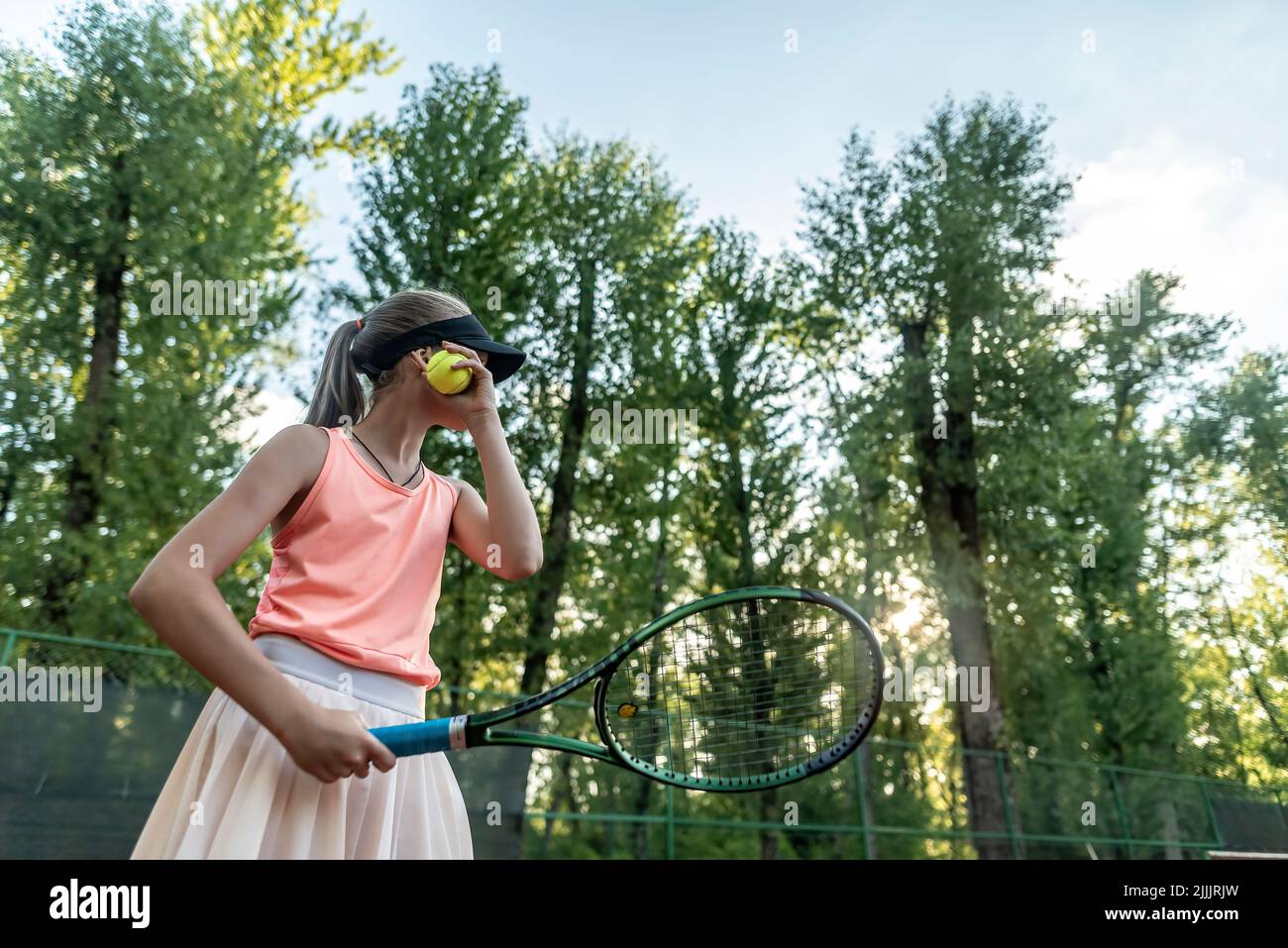 tennis girl player training in summer day in park Stock Photo
