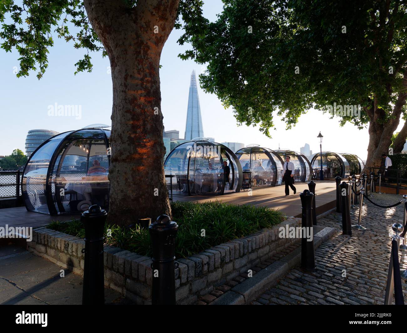 London, Greater London, England, June 22 2022: Glass Rooms restaurant beside the River Thames with The Shard behind. Stock Photo