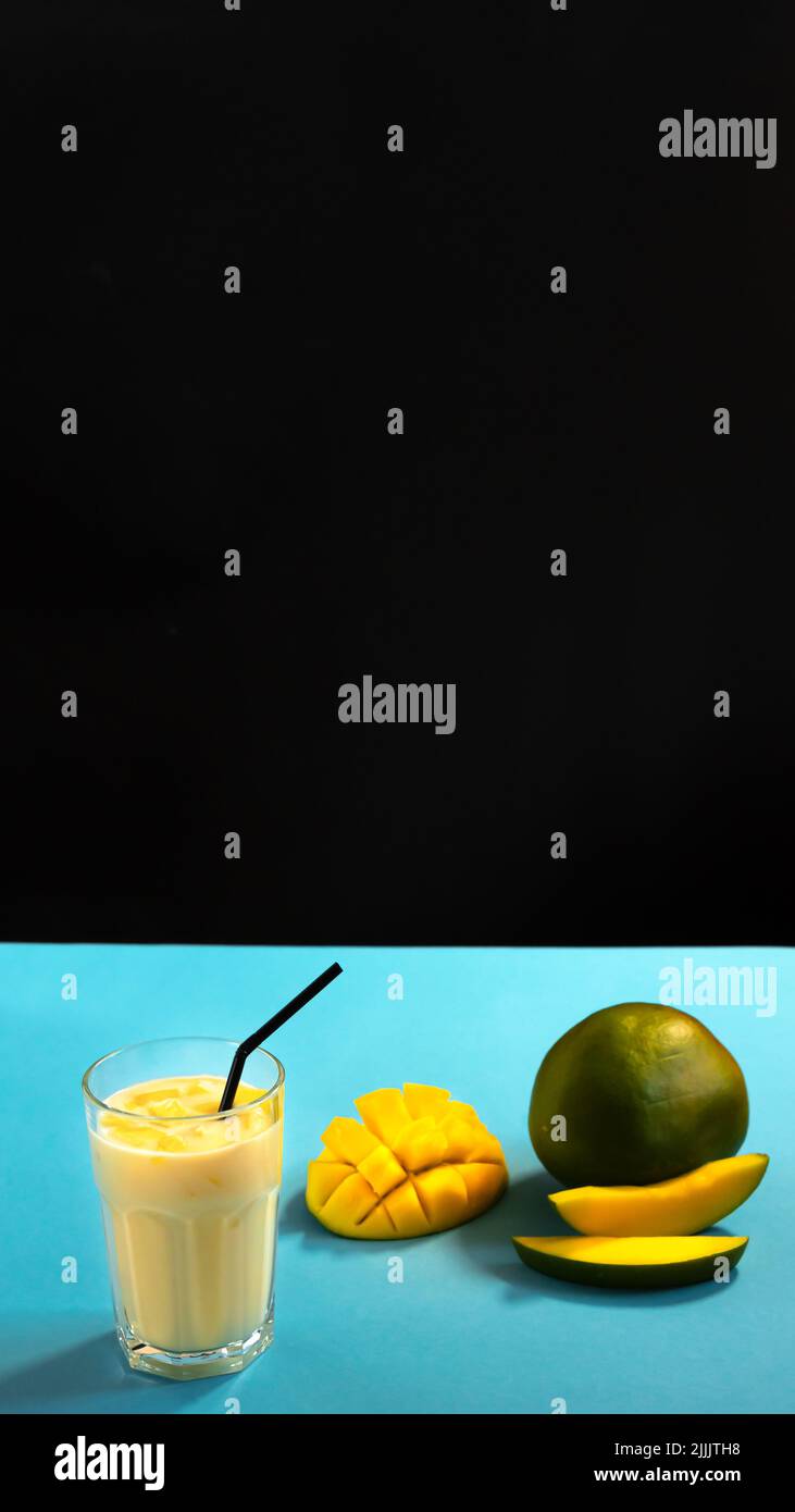 Traditional Indian cuisine. Milk milkshake on a black and blue ...