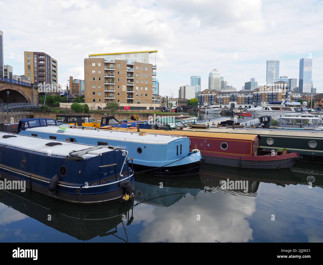 A variety of canal and leisure boats moored in Limehouse Basin in London Stock Photo