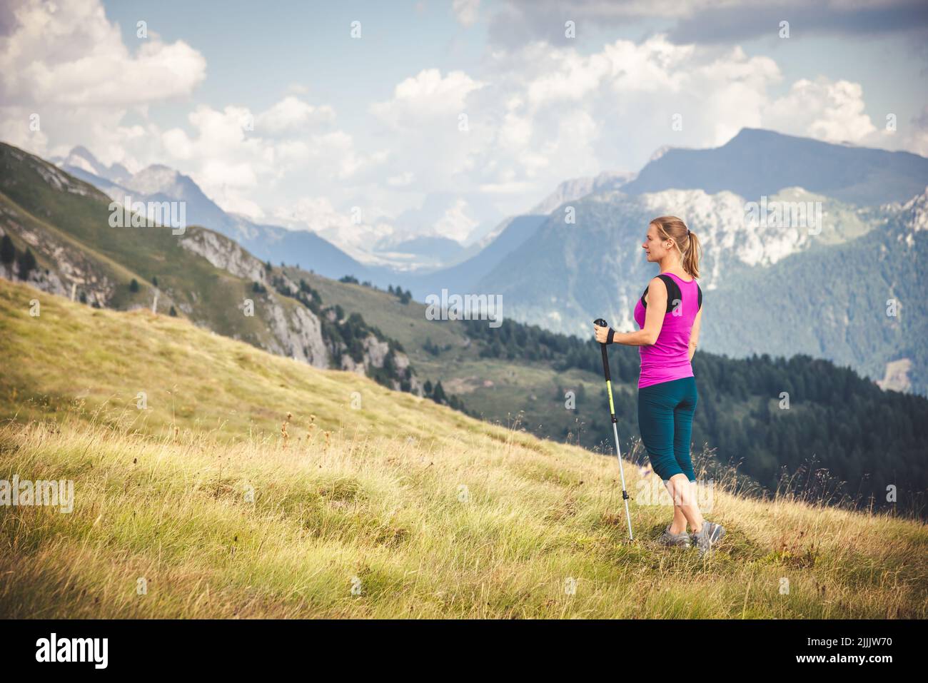 Young woman hiking in the mountains Stock Photo - Alamy