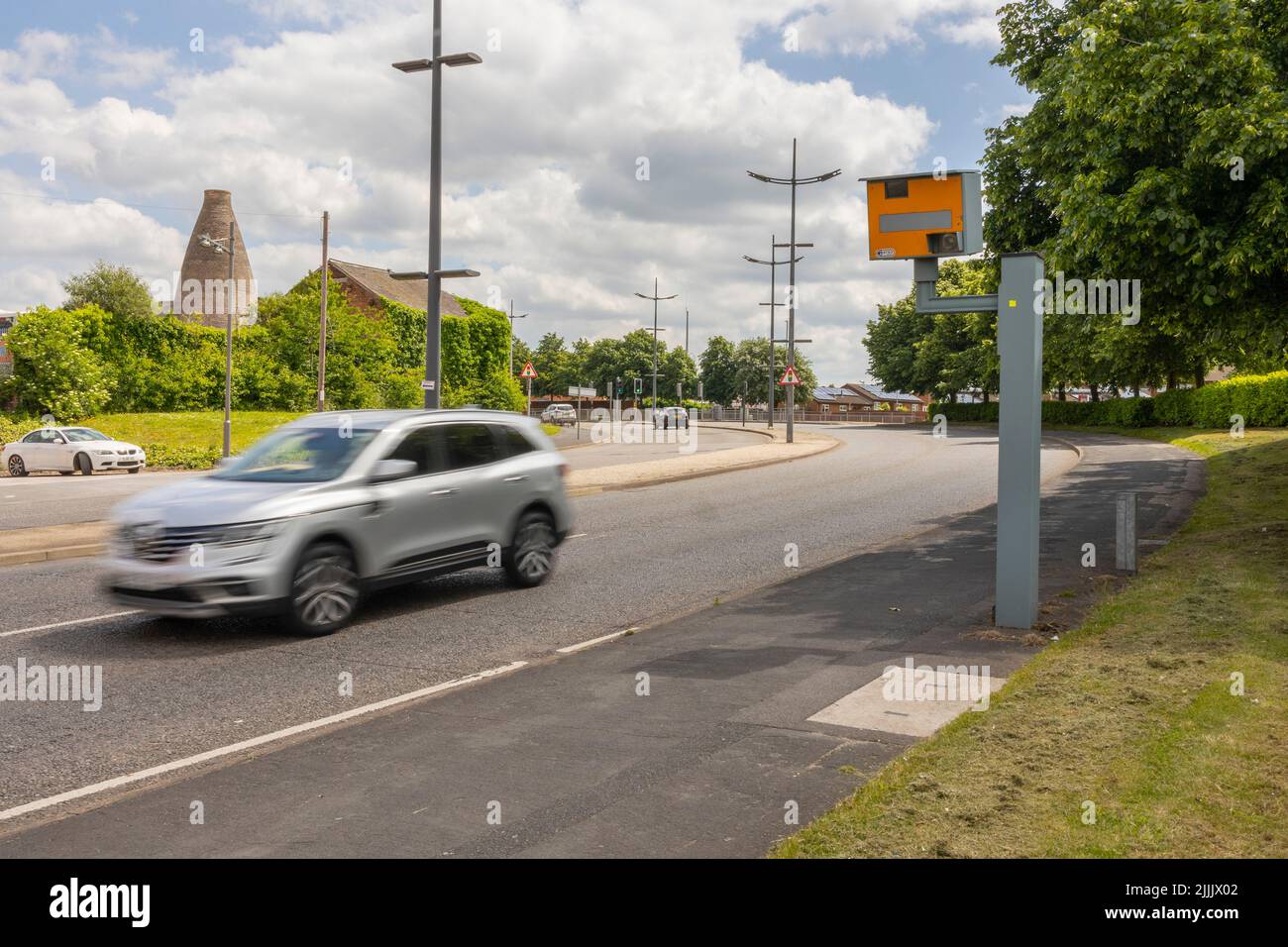 Hanley-Stoke-on-Trent, Staffordshire-United Kingdom April 21, 2022 UK static speed camera with speeding cars approaching on a city road motion blur ro Stock Photo