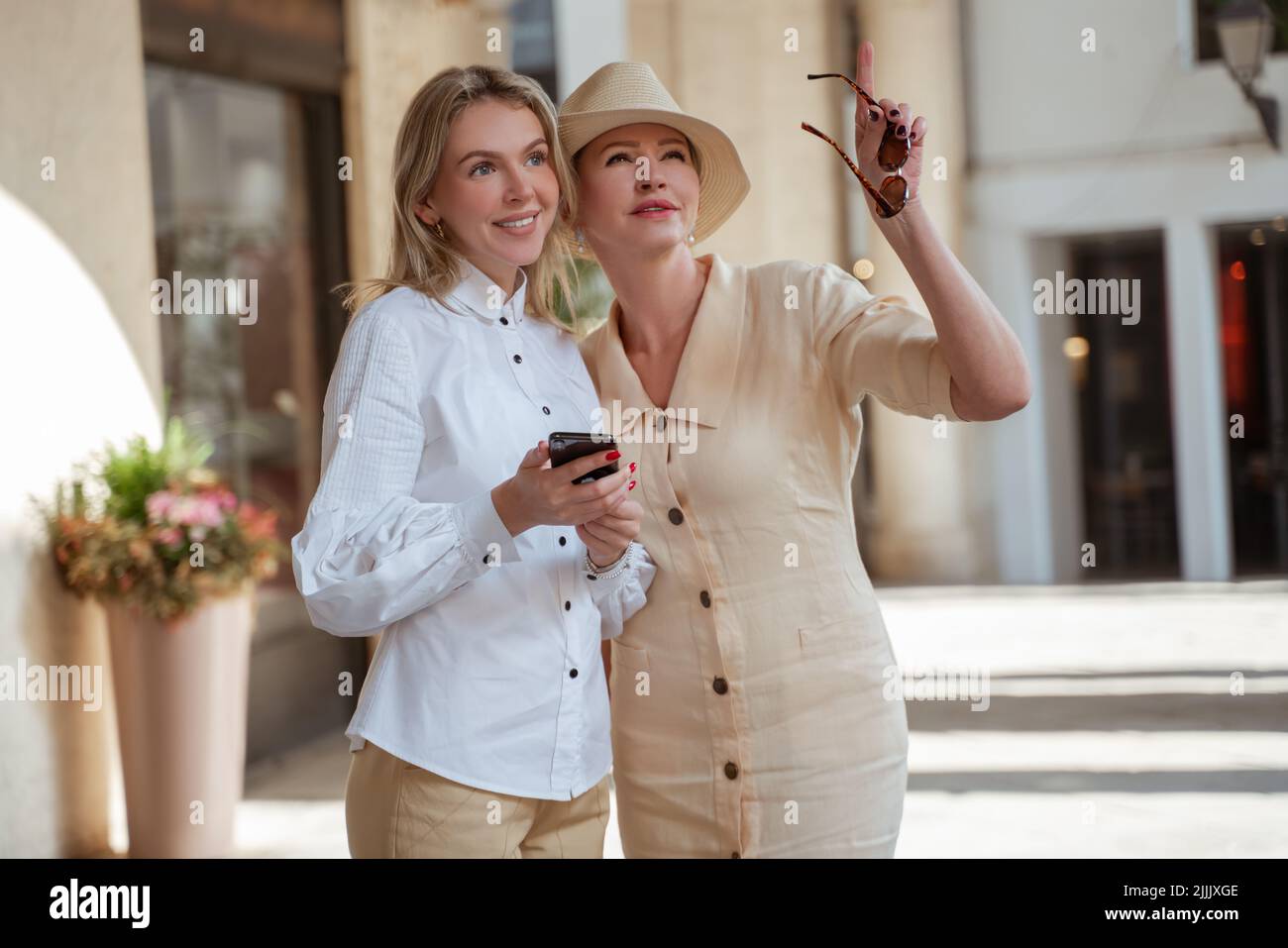 Two elegant female tourists seeing the sights Stock Photo