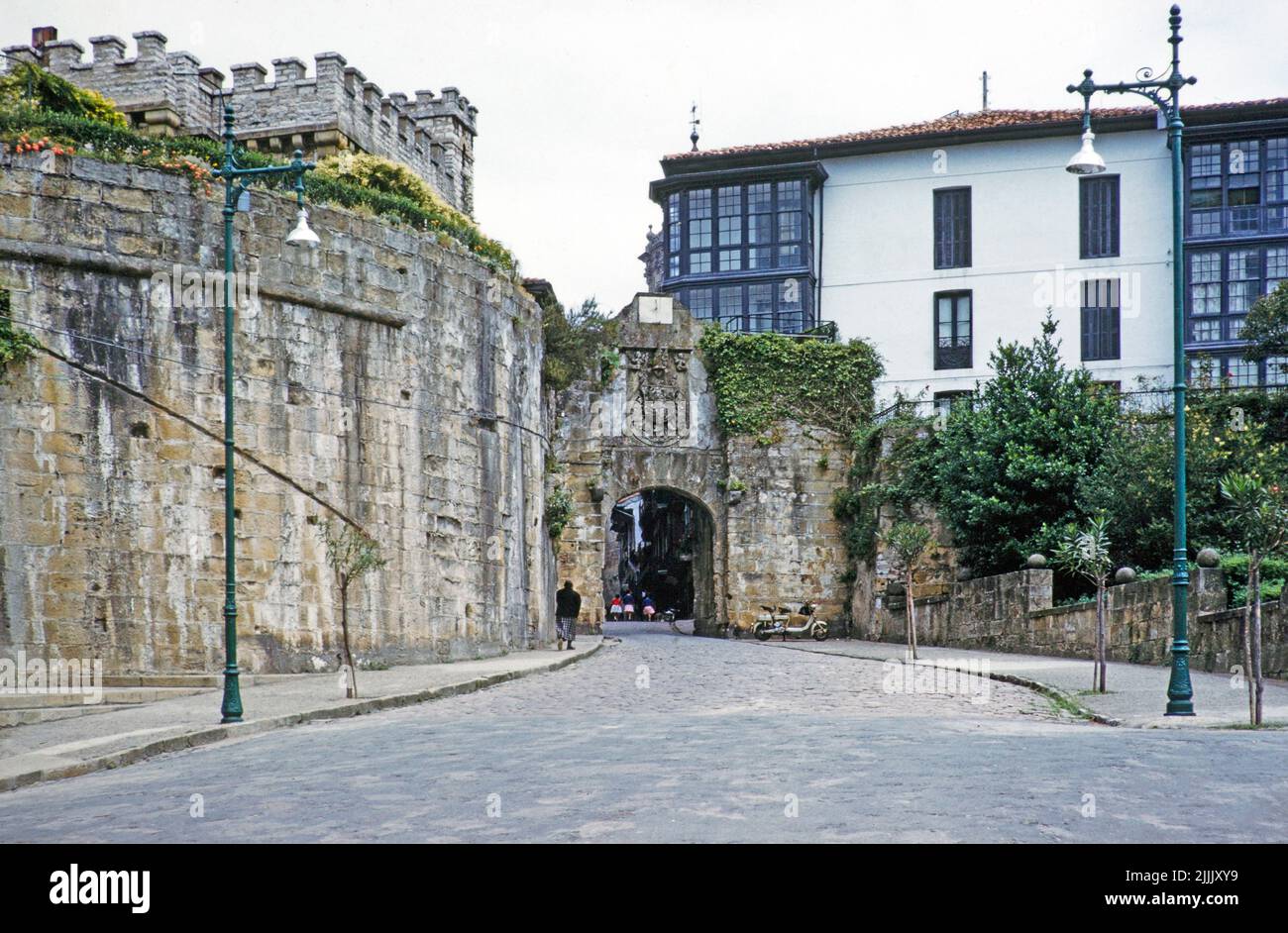 Entrance arch and historic buildings in Old Town of Hondarribia or Fuenterrabía, Basque country, northern Spain, 1959 Stock Photo