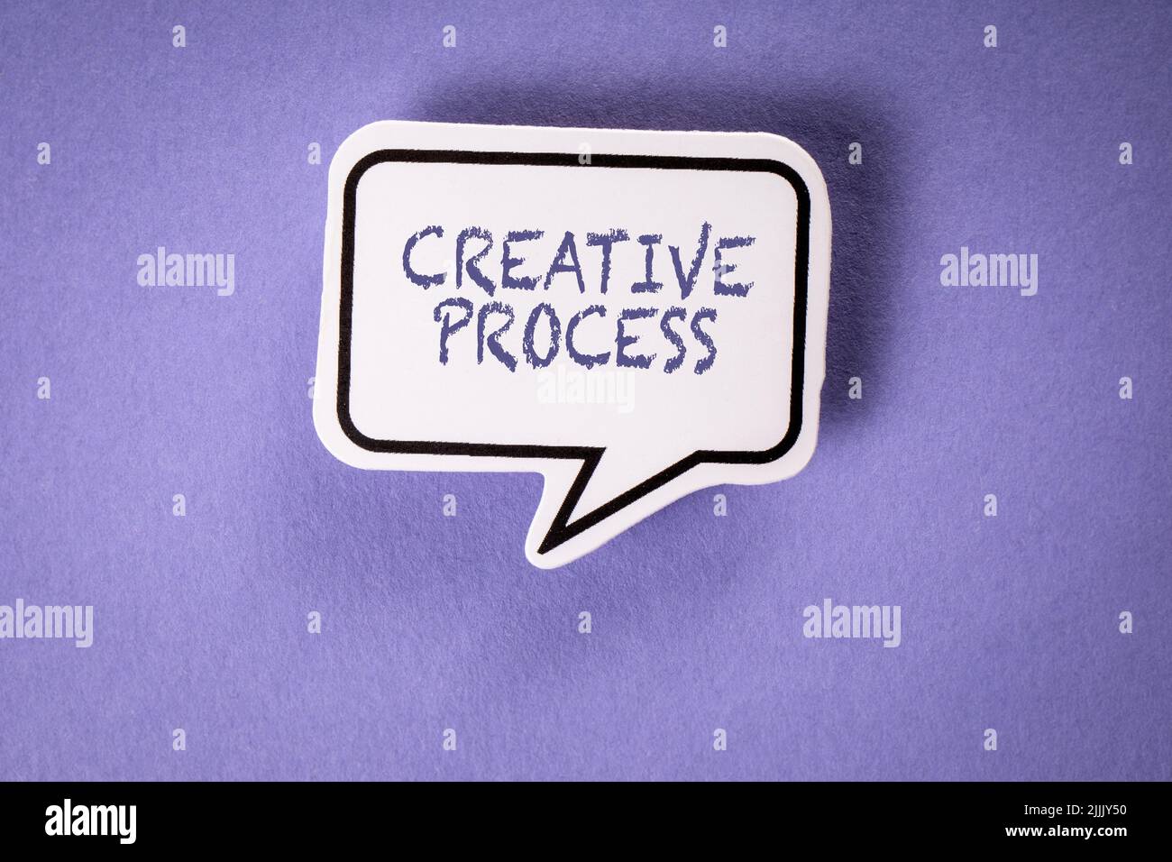 Creative Process. Speech bubble on purple background. Stock Photo
