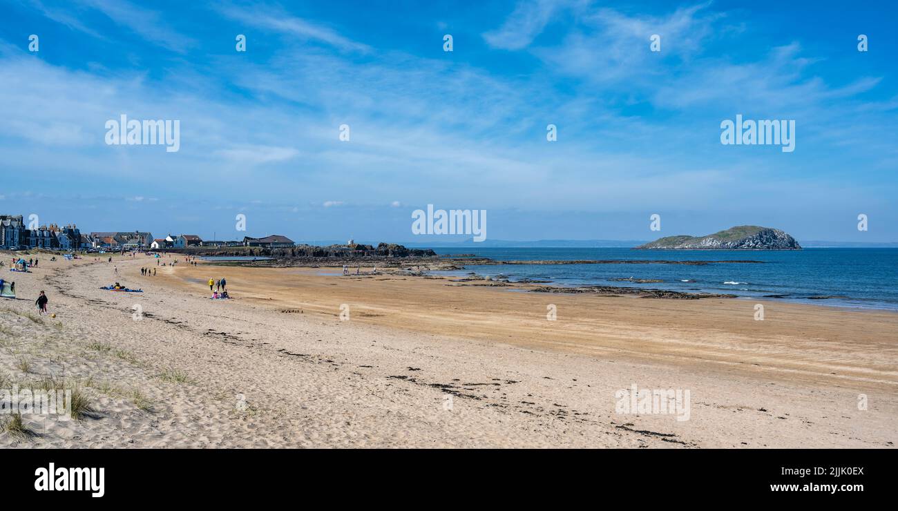 Panoramic view of Milsey Bay Beach towards Scottish Seabird Centre, with Craigleith Island on right, North Berwick, East Lothian, Scotland, UK Stock Photo