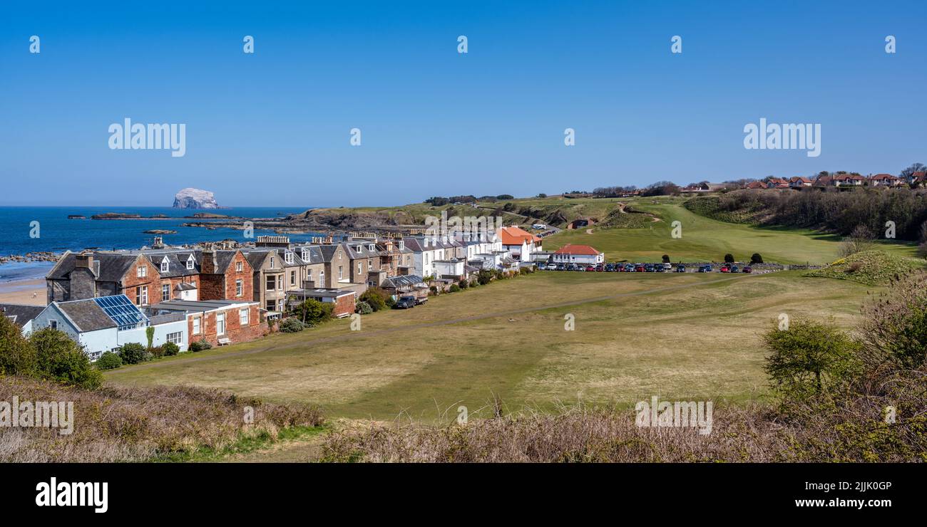 Panoramic view of houses on Marine Parade, with Glen Golf Course beyond, on seafront of coastal town of North Berwick in East Lothian, Scotland, UK Stock Photo