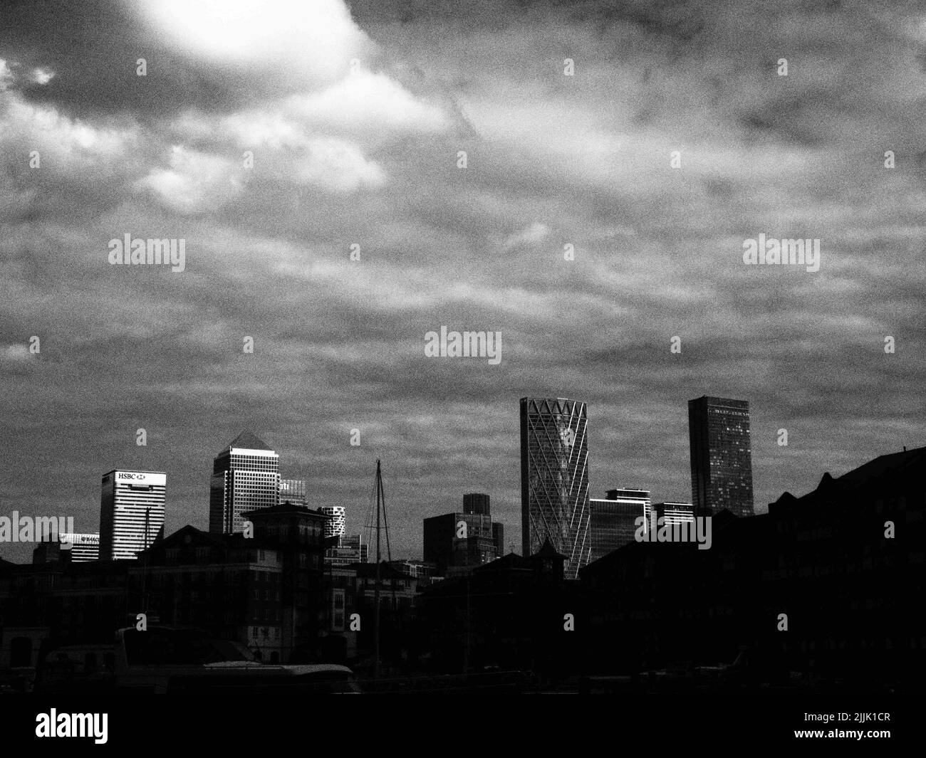 Dramatic monochrome view of Canary Wharf seen from Limehouse Basin in London Stock Photo