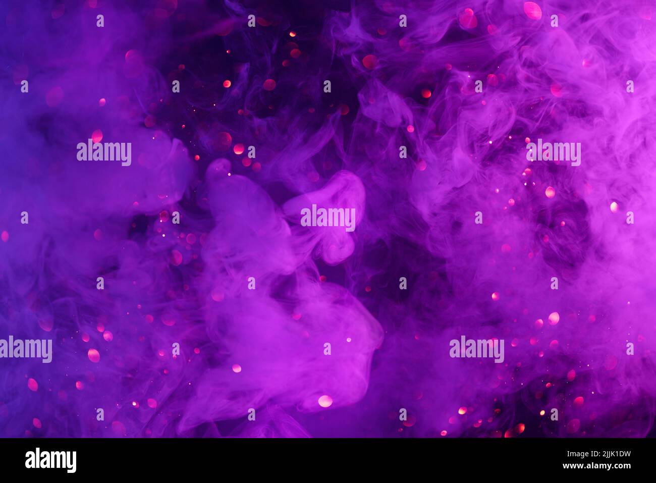 Purple smoke clouds and shiny glitter lights bokeh abstract cosmic fantasy background Stock Photo